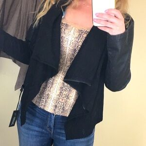 BLANKNYC faux leather jacket with scarf-like feature.
